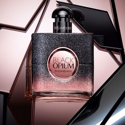 The glittery and illuminated bottle of Black Opium Floral Shock